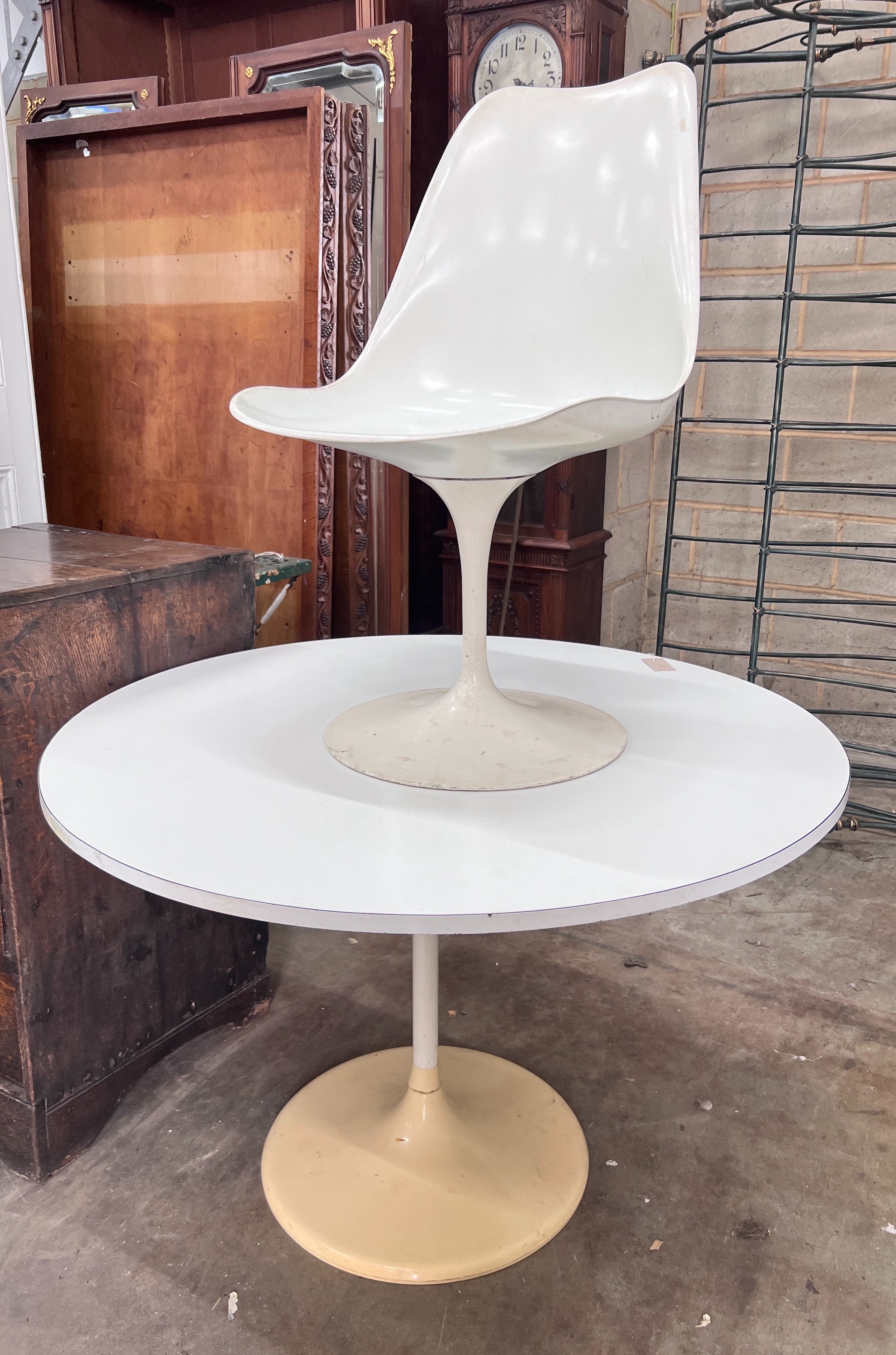 A small mid century white melamine topped ‘Tulip’ design table, 101cm, and a single matching chair *Please note the sale commences at 9am.
